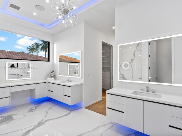 401 Bontona Ave, Fort Lauderdale, FL 33301 - full bath featuring a chandelier, two vanities, recessed lighting, and marble finish floors