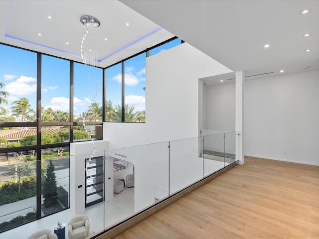 401 Bontona Ave, Fort Lauderdale, FL 33301 - hall with light wood-type flooring, recessed lighting, healthy amount of natural light, and expansive windows