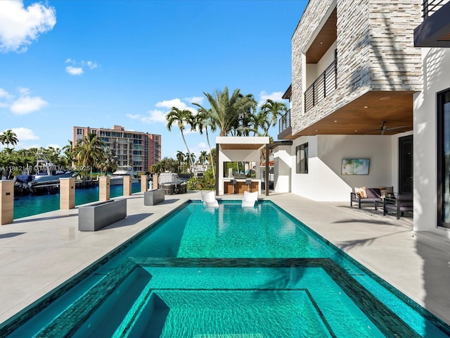401 Bontona Ave, Fort Lauderdale, FL 33301 - view of swimming pool with a pool with connected hot tub, ceiling fan, area for grilling, a patio, and a water view