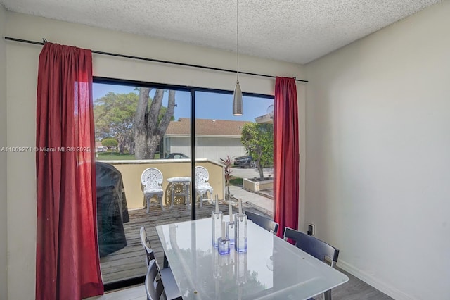 10 Afton Pl, Boynton Beach, FL 33426 - dining room with a textured ceiling, baseboards, and wood finished floors