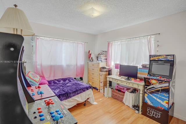 10 Afton Pl, Boynton Beach, FL 33426 - bedroom with wood finished floors and a textured ceiling
