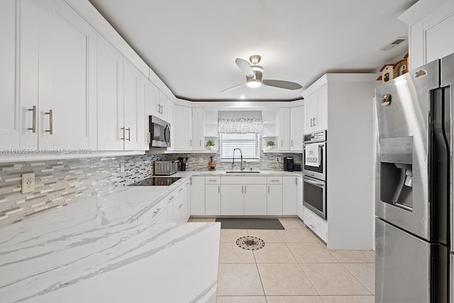5808 Polk St, Hollywood, FL 33021 - kitchen with stainless steel appliances, open shelves, a sink, ceiling fan, and backsplash