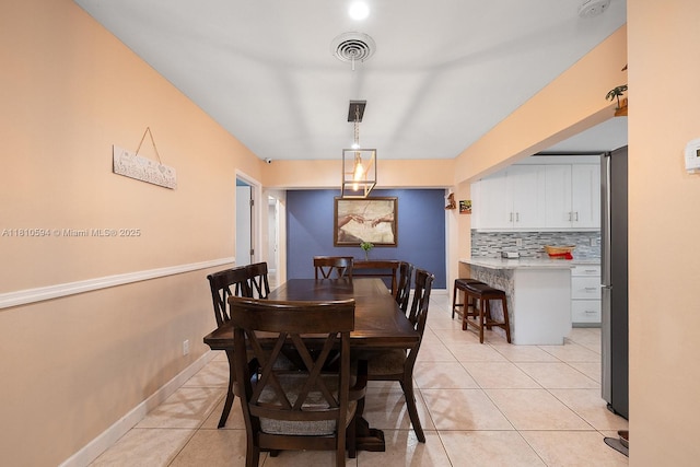 5808 Polk St, Hollywood, FL 33021 - dining area featuring light tile patterned floors and baseboards