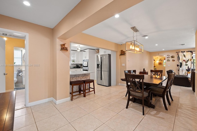 5808 Polk St, Hollywood, FL 33021 - dining room with light tile patterned floors, recessed lighting, and baseboards