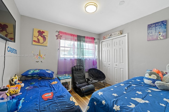 5808 Polk St, Hollywood, FL 33021 - bedroom with wood finished floors and a closet