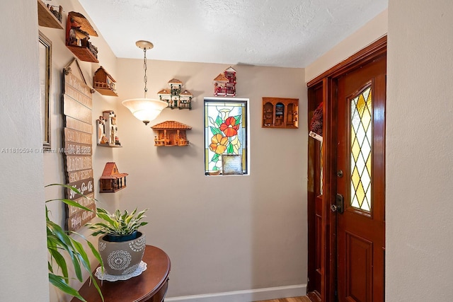 5808 Polk St, Hollywood, FL 33021 - foyer featuring a textured ceiling and baseboards