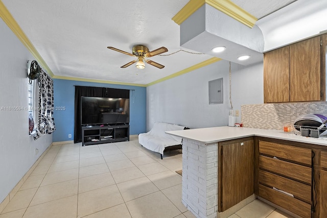5808 Polk St, Hollywood, FL 33021 - kitchen featuring ceiling fan, a peninsula, decorative backsplash, open floor plan, and brown cabinets