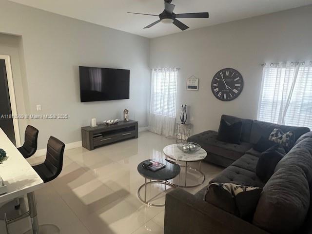 1020 Silktree Ln, Weston, FL 33327 - tiled living area with ceiling fan