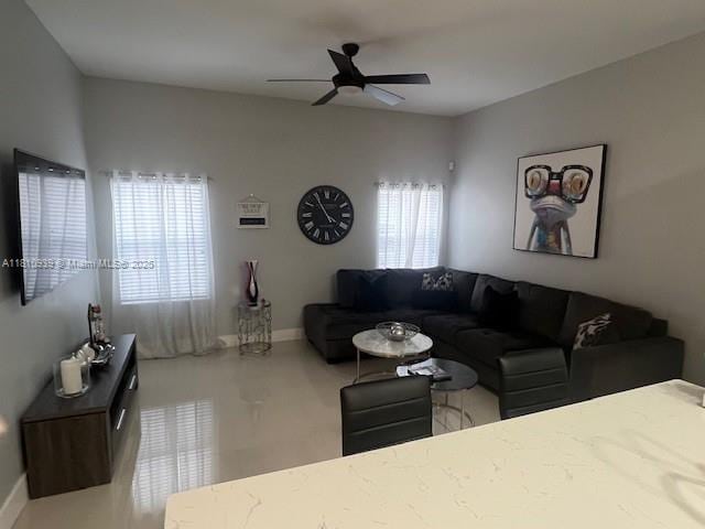 1020 Silktree Ln, Weston, FL 33327 - living room featuring a ceiling fan and baseboards