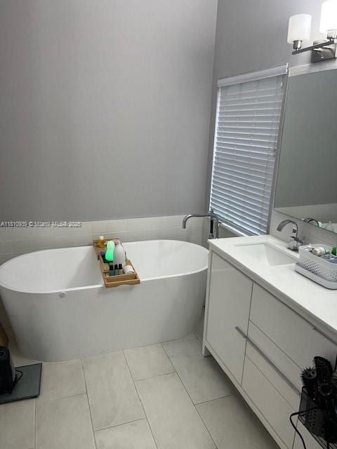 1020 Silktree Ln, Weston, FL 33327 - bathroom with vanity, tile patterned flooring, and a soaking tub