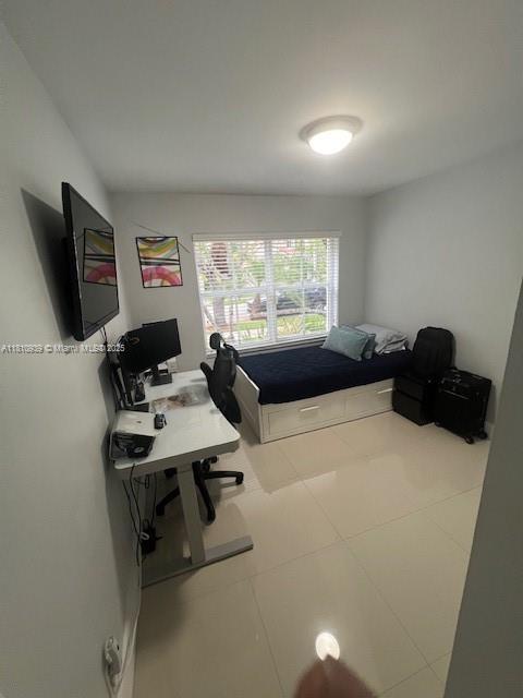 1020 Silktree Ln, Weston, FL 33327 - bedroom featuring an office area and tile patterned floors