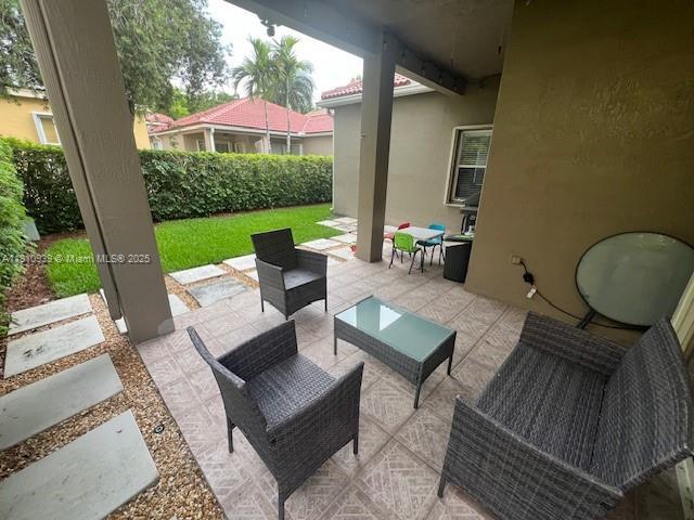 1020 Silktree Ln, Weston, FL 33327 - view of patio / terrace featuring an outdoor living space