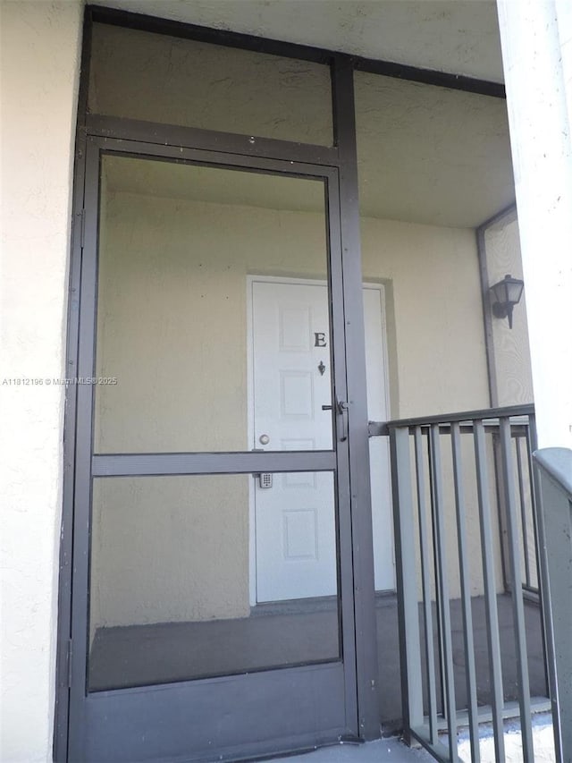 1331 S Franklin Ave Unit 1331E, Homestead, FL 33034 - view of exterior entry featuring stucco siding