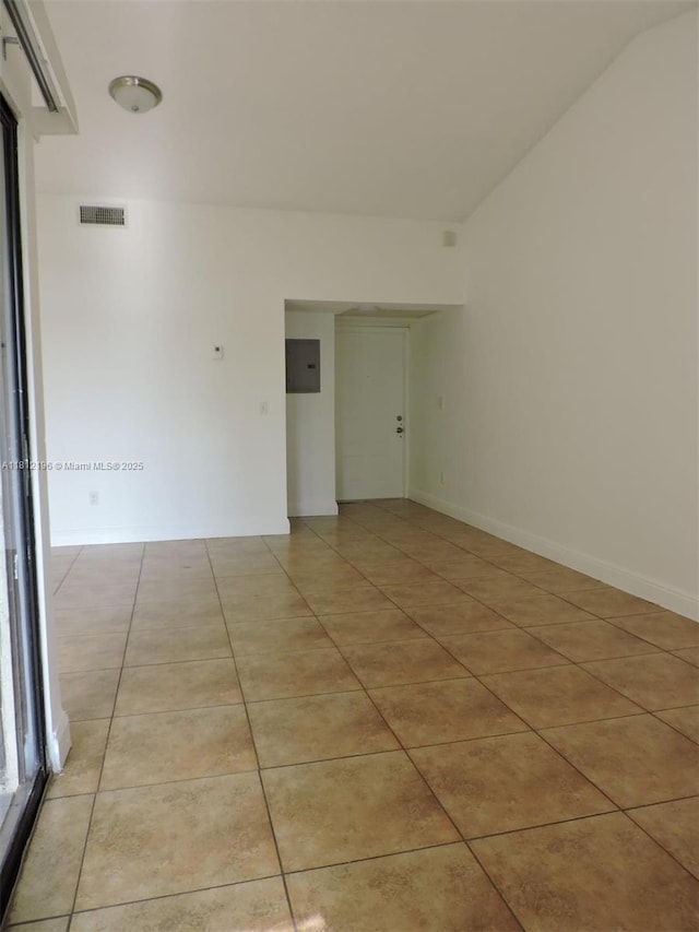 1331 S Franklin Ave Unit 1331E, Homestead, FL 33034 - spare room featuring light tile patterned floors and electric panel