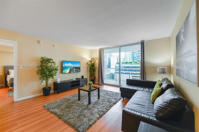 1200 Brickell Bay Dr Unit 2120, Miami, FL 33131 - living room with wood finished floors and a wall of windows