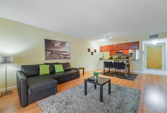 1200 Brickell Bay Dr Unit 2120, Miami, FL 33131 - living room featuring light wood-type flooring