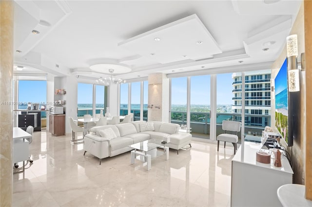 4775 Collins Ave Unit Ph4107, Miami Beach, FL 33140 - living room featuring a water view and a chandelier