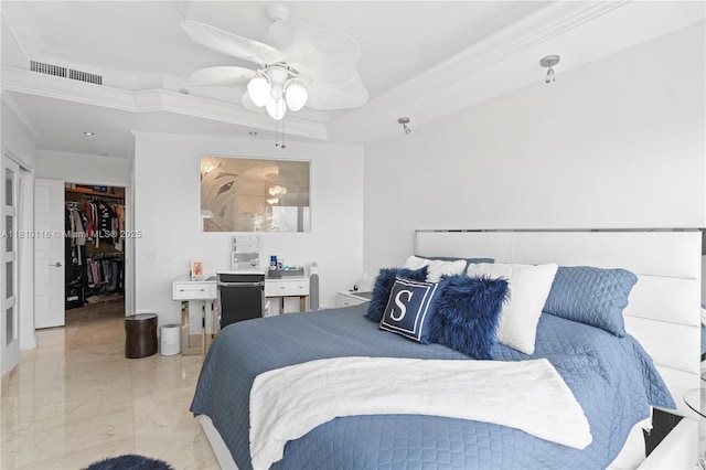 4775 Collins Ave Unit Ph4107, Miami Beach, FL 33140 - bedroom featuring ornamental molding, a raised ceiling, a ceiling fan, a walk in closet, and marble finish flooring