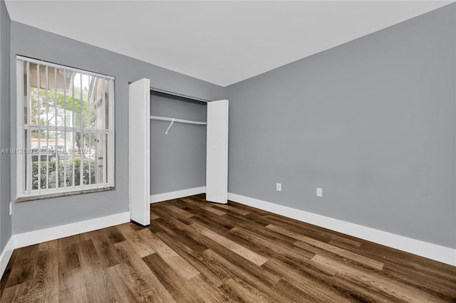 8109 SW 21st Ct Unit 8109, Miramar, FL 33025 - unfurnished bedroom featuring baseboards, dark wood-type flooring, and a closet