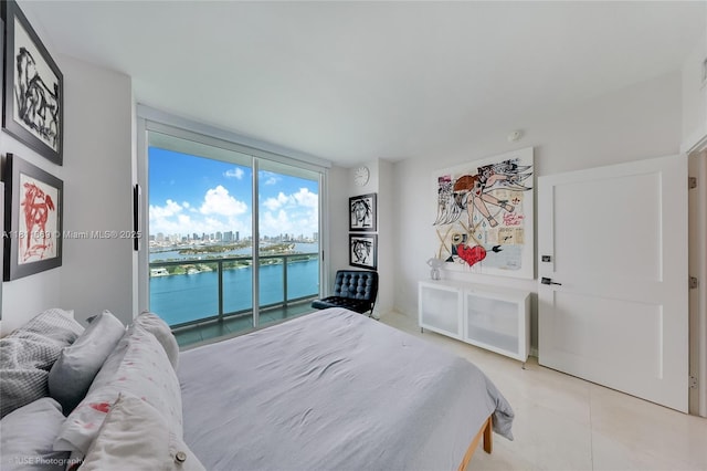 650 W Ave Unit Ph09, Miami Beach, FL 33139 - bedroom with a water view, access to exterior, and light tile patterned flooring