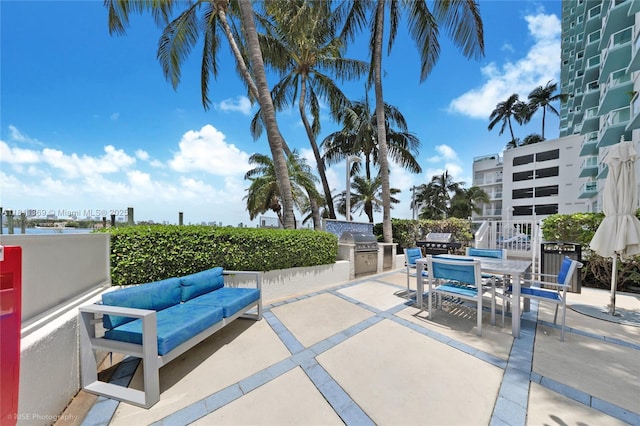 650 W Ave Unit Ph09, Miami Beach, FL 33139 - view of patio with outdoor lounge area, exterior kitchen, and outdoor dining space