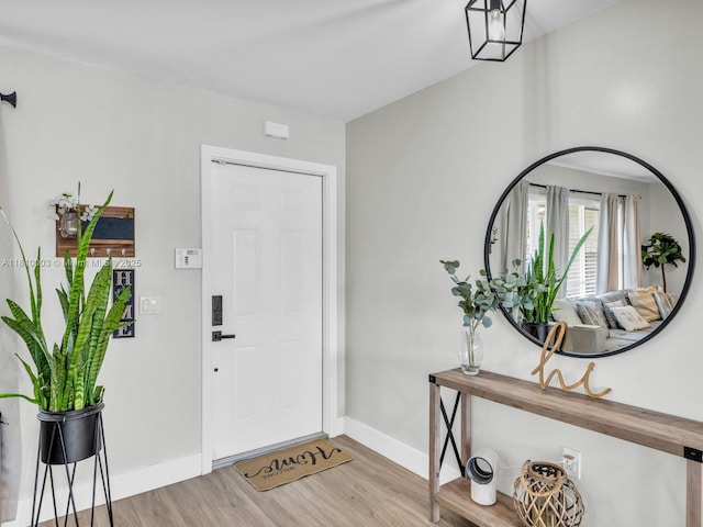 11610 NW 32nd Mnr, Sunrise, FL 33323 - foyer entrance featuring light wood finished floors and baseboards