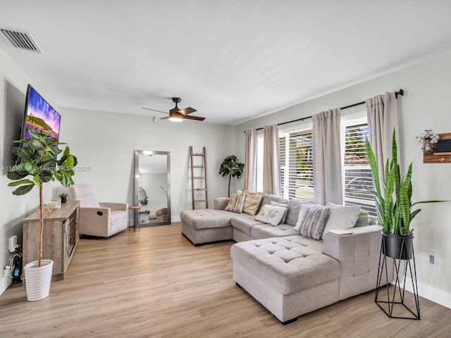 11610 NW 32nd Mnr, Sunrise, FL 33323 - living room with light wood finished floors, ceiling fan, and baseboards