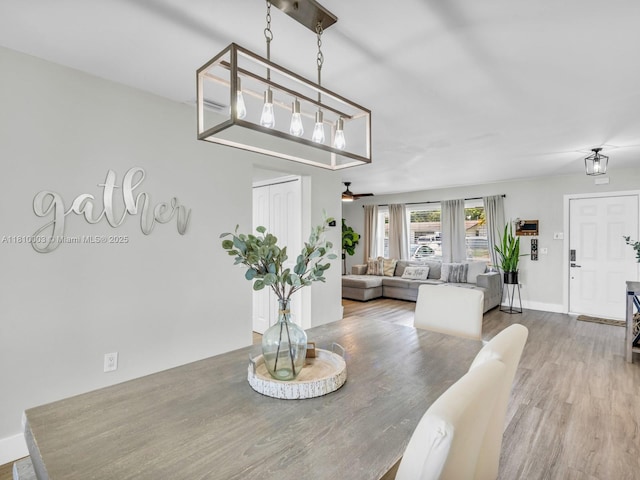 11610 NW 32nd Mnr, Sunrise, FL 33323 - dining room with a ceiling fan, wood finished floors, and baseboards