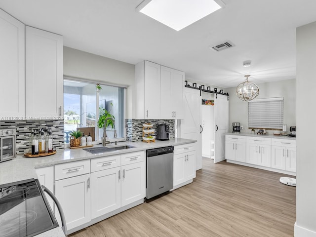 11610 NW 32nd Mnr, Sunrise, FL 33323 - kitchen with dishwasher, electric range, a sink, white cabinetry, and tasteful backsplash