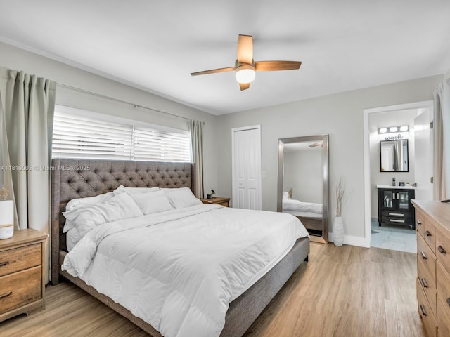 11610 NW 32nd Mnr, Sunrise, FL 33323 - bedroom featuring a closet, light wood-type flooring, a ceiling fan, ensuite bath, and baseboards