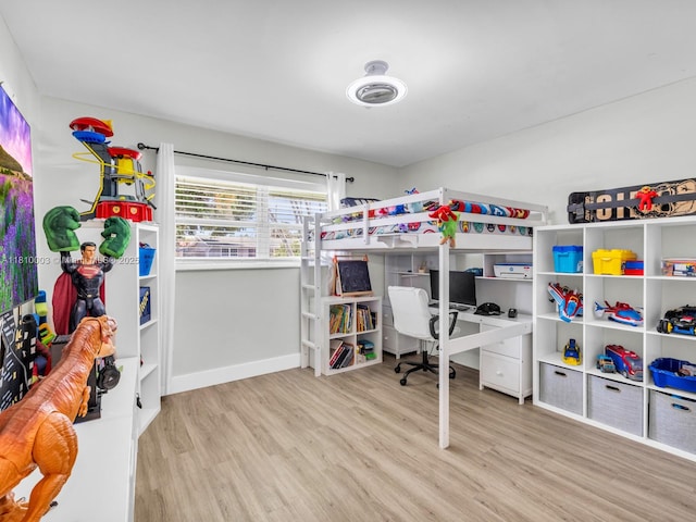 11610 NW 32nd Mnr, Sunrise, FL 33323 - bedroom with wood finished floors, baseboards, and an office area