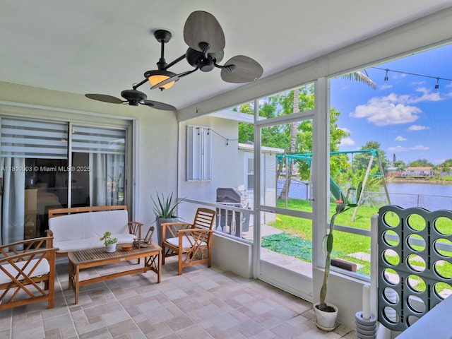 11610 NW 32nd Mnr, Sunrise, FL 33323 - sunroom with a water view, a ceiling fan, and healthy amount of natural light