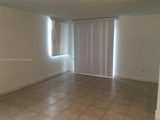 850 N Miami Ave Unit W-2003, Miami, FL 33136 - empty room featuring light tile patterned floors and baseboards
