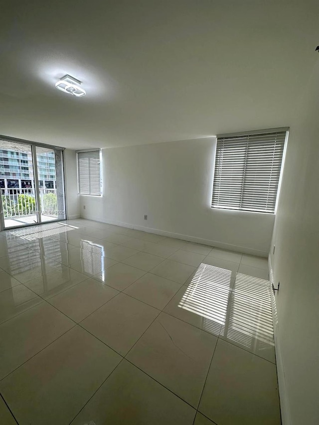 850 N Miami Ave Unit W-2003, Miami, FL 33136 - unfurnished room with light tile patterned floors and baseboards