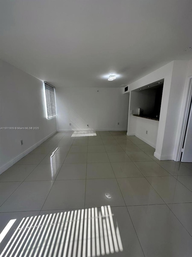 850 N Miami Ave Unit W-2003, Miami, FL 33136 - tiled spare room featuring baseboards