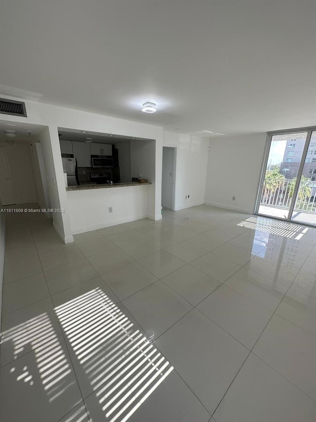 850 N Miami Ave Unit W-2003, Miami, FL 33136 - empty room featuring tile patterned floors and baseboards