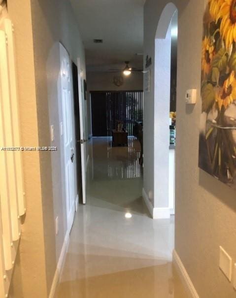 4913 SW 141st Ave Unit 2, Miramar, FL 33027 - hall featuring arched walkways and baseboards