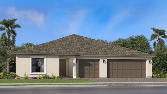 17372 SW 285th St, Miami, FL 33030 - view of front facade featuring a shingled roof, an attached garage, driveway, and stucco siding