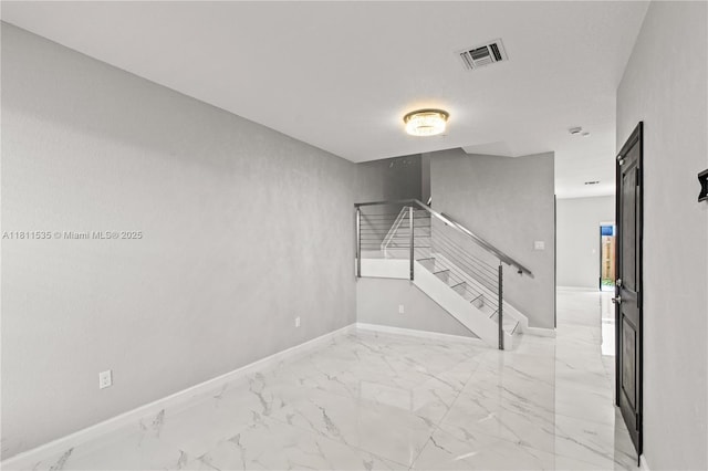 221 SW 159th Way, Pembroke Pines, FL 33027 - empty room with light marble finish floors, stairway, and baseboards