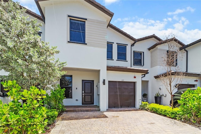 221 SW 159th Way, Pembroke Pines, FL 33027 - view of front of home with stucco siding, a garage, and decorative driveway