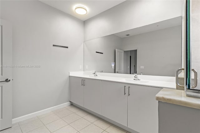 221 SW 159th Way, Pembroke Pines, FL 33027 - bathroom with double vanity, baseboards, and tile patterned floors