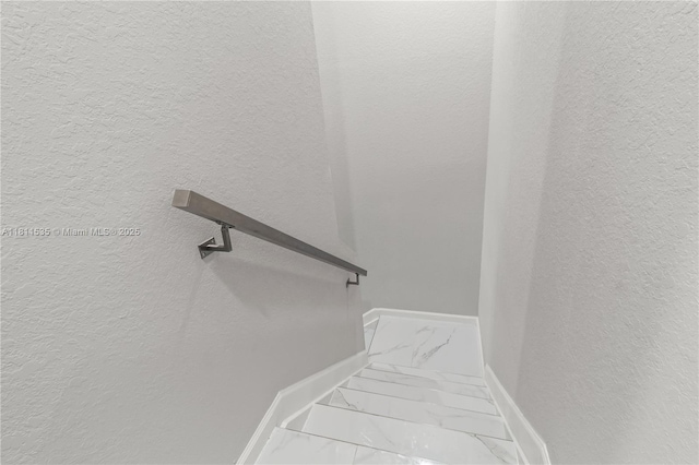 221 SW 159th Way, Pembroke Pines, FL 33027 - staircase with marble finish floors, baseboards, and a textured wall