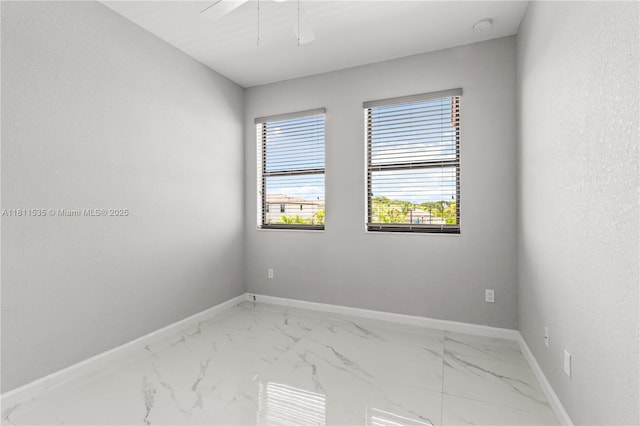 221 SW 159th Way, Pembroke Pines, FL 33027 - unfurnished room featuring baseboards, light marble finish flooring, and a smoke detector