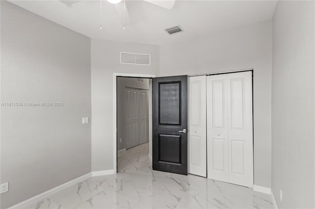 221 SW 159th Way, Pembroke Pines, FL 33027 - unfurnished bedroom with baseboards, marble look tiles, a closet, and a ceiling fan