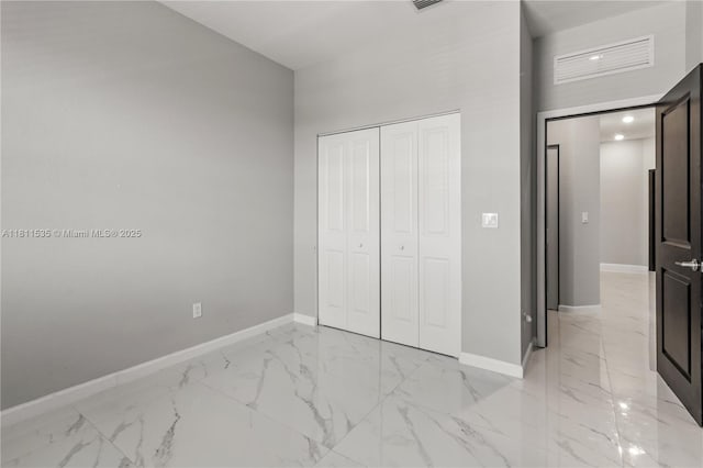 221 SW 159th Way, Pembroke Pines, FL 33027 - unfurnished bedroom with baseboards, light marble finish flooring, a towering ceiling, and a closet