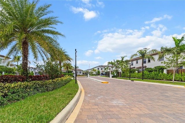 221 SW 159th Way, Pembroke Pines, FL 33027 - view of decorative street with a residential view, curbs, a gated entry, and street lights