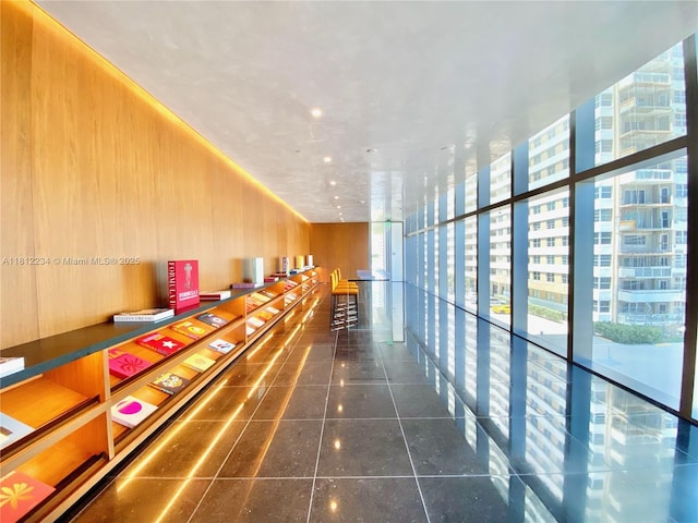 2000 S Ocean Dr Unit 33A, Hallandale Beach, FL 33009 - hall with wooden walls and floor to ceiling windows