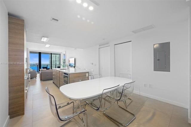 650 NE 32nd St Unit 2502, Miami, FL 33137 - dining space with electric panel and light tile patterned floors