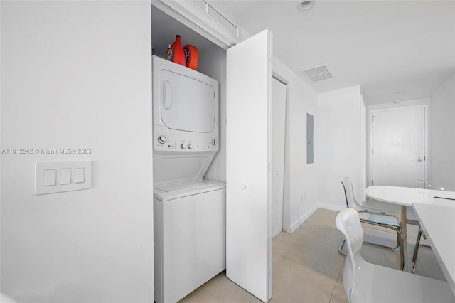 650 NE 32nd St Unit 2502, Miami, FL 33137 - washroom with stacked washer / drying machine, electric panel, and light tile patterned flooring