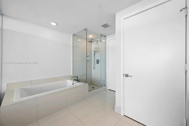 650 NE 32nd St Unit 2502, Miami, FL 33137 - bathroom with a bath, a shower stall, tile patterned flooring, and recessed lighting